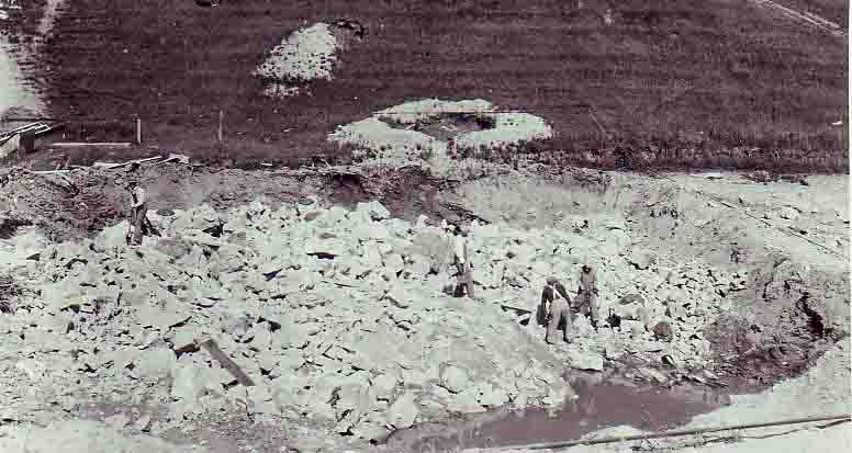 1924 View of rock in settling tank after being dyn